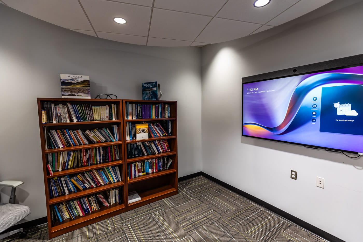 AOC office building room with books and TV